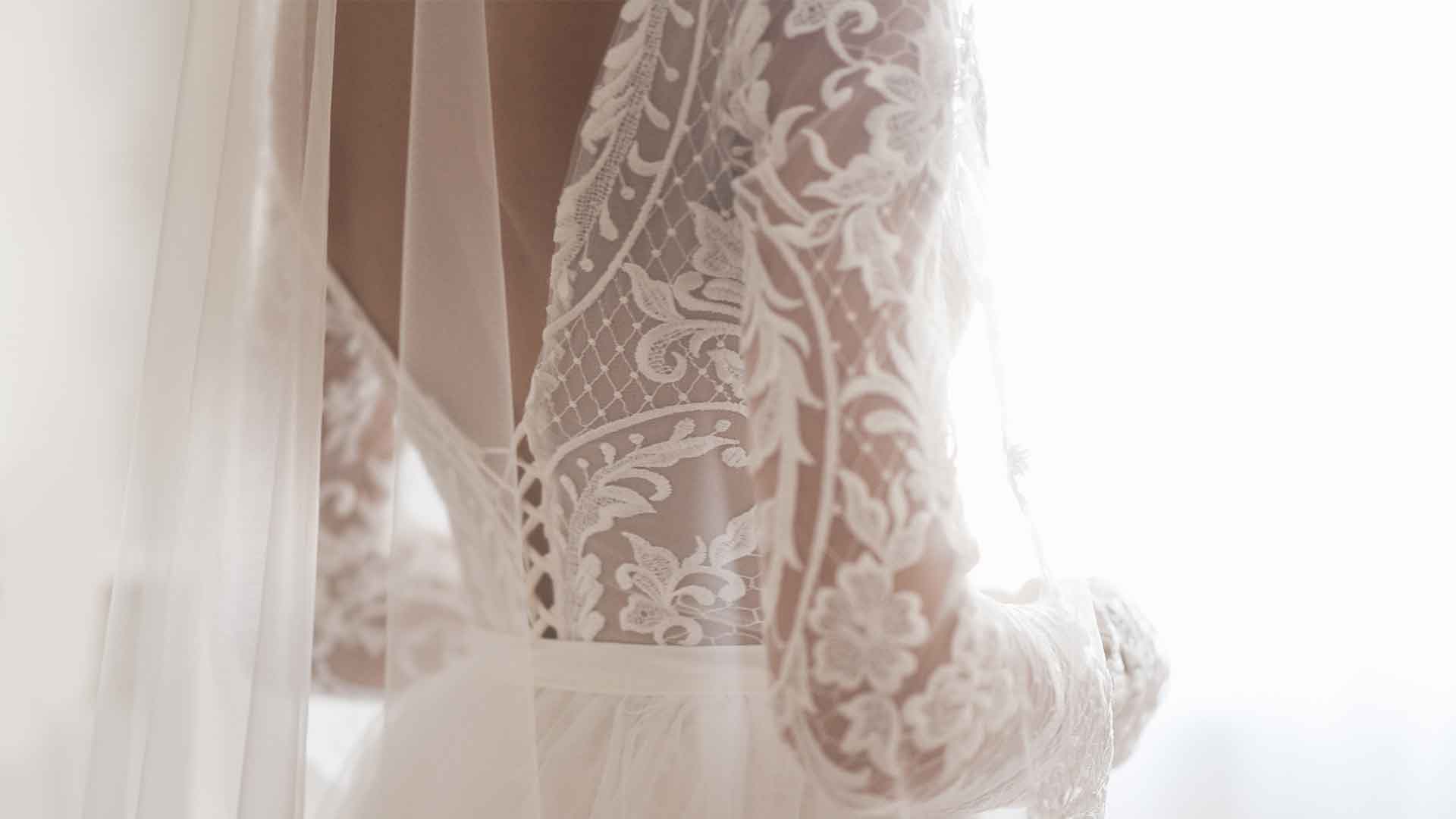 A bride in a white wedding dress with a veil.